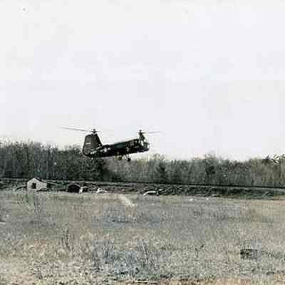 Helicopter Hovering over a Field