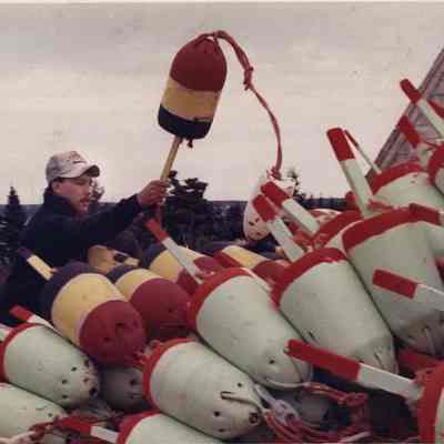 A photo view of a pile of lobster buoys. 10/11/1990.