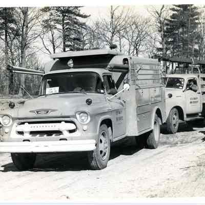 Two Brunswick Naval Air Station Utility Trucks