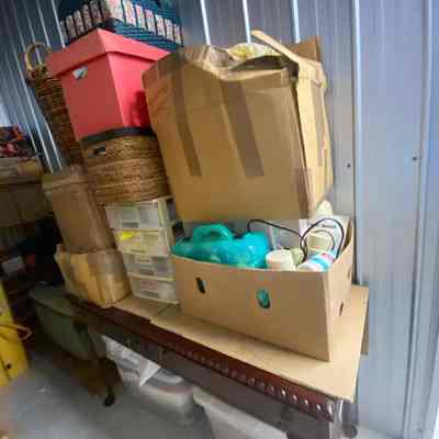 All the sewing material and fabric are under or on the hallway table