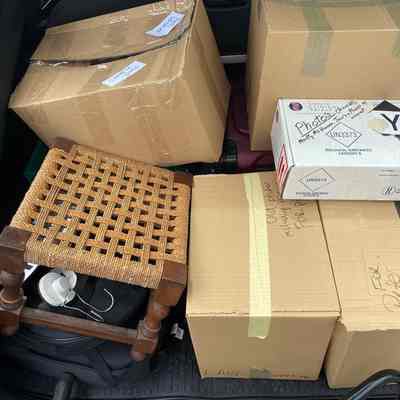 Suitcase plus 4 large boxes and 1 smaller box (all unopened)