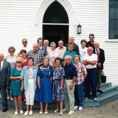Dennysville High School reunion group gathered on the front step of the Congregational Church building, in the 1980s: Picture includes, Front Row, middle, Shirley (Ward) Wilder Godet, Alberta (Brown) and Ralph Preston, Barbara (Brown) Lingley, and in the back Row, Lewis Lyons, Mary Mahar, Albert Mahar, Rebeca Hobart, Milton Lyons, _?_ Karen Seeley, Lester Seeley.