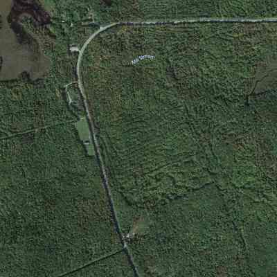 Cooper, Maine, on Google Earth: The old Cooper Post Office and an earlier schoolhouse were located near the sharp corner visible on this satellite image from Google earth accessed on 08-12-2023.