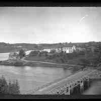          Boats, wharves and houses on the Dennys River, c. 1880; Aaron Hobart's house in Edmunds dominates this a view from the belfry of the Congregational Church in Dennysville.  The Lower Bridge links the two towns, while the warehouse and lumber beside Allan's wharf and the schooner and houses along Fosters Lane on the distant shore testify to the prosperity the communities in the late nineteenth century.  Photograph by Dr. John P. Sheahan of Edmunds.
   
