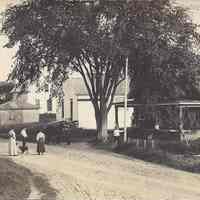          Main Road in Meddybemps, Maine, c. 1900; View up the Main Road, with people and animals in front of the Meddybemps Church building. c. 1900
   