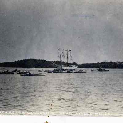 Schooner David Cohen after launching on July, 1918 at Pushee Brothers shipyard in Dennysville, Maine: A fleet of small boats surround the Schooner David Cohen after it was launched in July, on the Dennys Bay, in 1918.