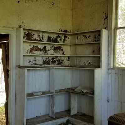 East Ridge School House, Cathance Township, Maine: Empty shelves once held books and other teaching tools.