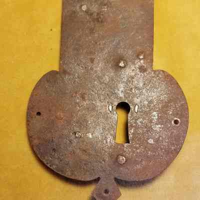 French Iron Lock, mid-eighteenth century: View of the front plate of a mid-eighteenth century French iron lock found in Dennysville, Maine.