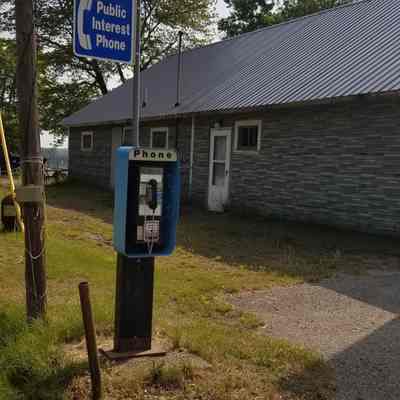 Public Telephone in Meddybemps, Maine: This public interest telephone replaced the phone booth that stood beside Palmeter's Store in Meddybemps, Maine, for many years.