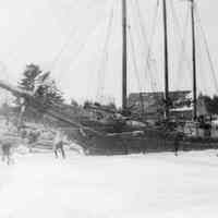          Schooner Jennie French caught in the ice at Allan's Wharf, on the Dennys River, Edmunds, Maine; Allan's warehouse is visible behind the schooner, with the Congregational Church and Lincoln House on the Dennysville side of the river are seen on the opposite side of the Dennys River.
   