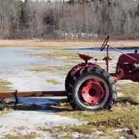          Vintage Farmall tractor with sickle bar.; Located at the Brown house Dennysville , Maine.
   
