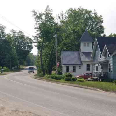 Main Street, Route 191, Meddybemps, Maine: Lombard Lane, a store, church building and private residence line Route 191 as it winds through the village of Meddybemps, Maine.