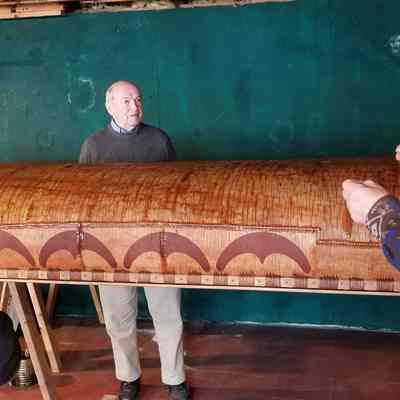 Donald Soctomah explaining Passamaquoddy Canoe building to DRHS museum staff.: Tribal Historic Preservation Officer Donald Soctomah discusses birchbark canoe making with Dennys River Historical Society President Ronald Windhorst and Curator Melina Jaques at the Wabanaki Museum in Indian Township in 2018.