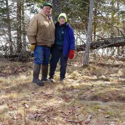 Robert and Jane Bell standing on the old Bell family burying ground with graves dating from 1793.