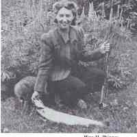          Mina Phinney with a freshly caught salmon on the Denny River; Reproduced from 