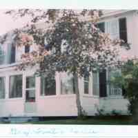          Benjamin Foster House, Dennysville, Maine, in the 1980's.; Faced of the Deacon Benjamin Foster House, with an enclosed front porch, during the residence of Donald and Mina Phinney
   