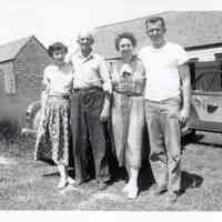          Left to right: Phyllis Jean, Bernard Gardner's wife; Ralph Hallowell; his daughter Hilda Hallowell Gardner; and Bernard Gardner.; This picture is taken in front of the ell of Capt. Hallowell's family home.
   