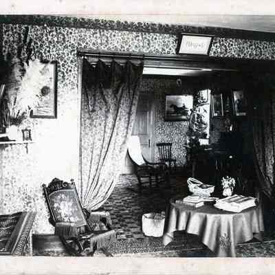 Front and back parlors at the A.L.R. Gardner house, Dennysville, Maine, ca. 1890.