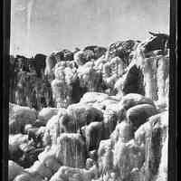          Ice coated Mill Dam on the Dennys River, c. 1885; Crystalized ice covers the stonework of the Lincoln's mill pond dam on the Dennys River in the photograph by Dr. John P. Sheahan of Edmunds, Maine.
   