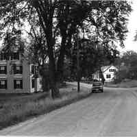          The Lane in Dennysville, with the Hotel and Livery stable built by John D. Allan in 1896.; Photograph by Frank Beard for the Maine Historic Preservation Commission in 1980.
   