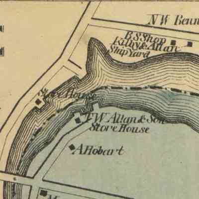 T.W. Allan and Son wharves, shipyard and storehouses on both side of the Dennys River: Wharves and houses line the banks of the Dennys River, including the N.W. Bennet house on Foster Lane, later acquired by T.W. Allan and Son next to the shipyard he operated with his brother-in-law John Kilby.