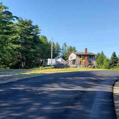 Katie Maker's Corner on Route 86, Marion, Maine: Modern Route 86 bends to the right, while the old Stagecoach Road continues ahead on the left towards Machias.