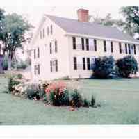          View of the Theodore Lincoln House, Dennysville, Maine, c. 1960; Exterior view of the Dennysville's Lincoln House when it was owned and operated by Dorothy Casey as a bed and breakfast establishment for passing travelers.  The old barn can be seen on the hill behind the house, before it was taken down and removed in 1970.
   