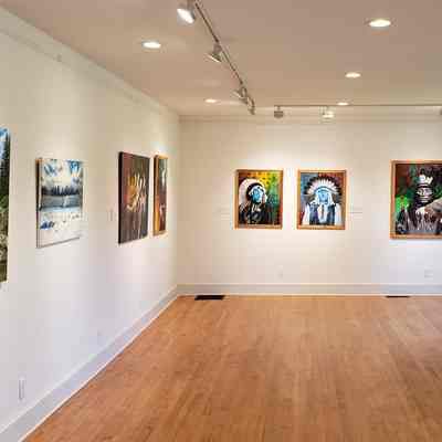 Art Gallery in the former Youth Center, Dennysville, Maine: Exhibitions of art from around the world hang in this small, focused gallery in what was once the E.D.M. Youth Center on Cemetery Road in Dennysville, Maine.  Paintings by local Passamaquoddy artist Norma Randi (Smith) Marshall were on display during the summer of 2023.