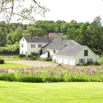 Aaron K. Hobart's house in Edmund, Maine: Aaron K. Hobart built his house in Edmunds adding an imposing two story front section to Samuel Scott's original dwelling, which served as an ell.  Dennysville's Lincoln House appears in the distance, across the Dennys River.