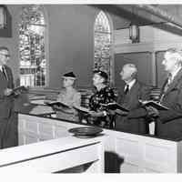          Congregation with the Reverend Mr. Carl Kingsbury in the 1950's.; A note on the back of the photo reads:  Pastor Carl Kingsbury, Cousin Margaret Wilder, Annie Gardner, Irving Kilby, Maxwell Gardner, (in a different hand) Edith M. Tobey, Dennysville-Edmunds Congregational-Christian Church, 150th Anniversary celebration, 1955.  Photograph stamped: The Irene Smith Studio, Machias, Maine.
   