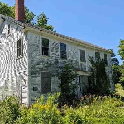 The Riverside Inn in 2022: No longer a public house since it closed in 1942, the old inn became home to a number of local families, and is now in disrepair.