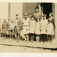          Students at Lower Dennysville School, 1928; A picture of a group of students on the step of the schoolhouse in Lower Dennysville, in 1928.
   