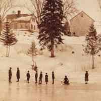          Skating Party on the Dennys River in front of the Theophilus Kilby house and barn, in the 1880's; View of skaters, men, women and children, on the Dennys River with the Theophilus Kilby House and Barn on hillside above.  Photograph taken by John P. Sheahan in the 1880's, directly across from his house on the Edmunds side of the river.
   