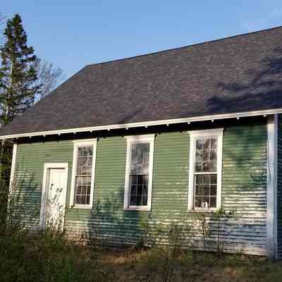 Lower Dennysville Schoolhouse, relocated: The original schoolhouse in Lower Dennysville was relocated to this site facing U.S. Route 1 in Pembroke where it served as a garage for many years.