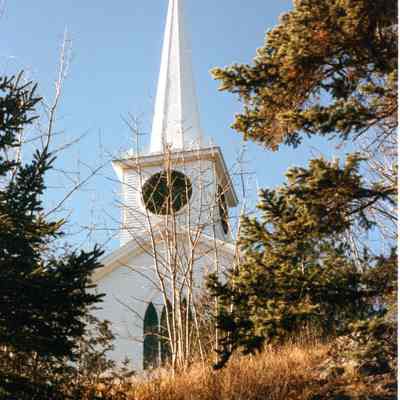 Congregational belfry and steeple in the 1980's: View of the Congregational Meetinghouse from Route 86, after the first restoration of the weathervane in the 1980's.