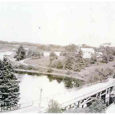 Lower Bridge across the Dennys River.: Looking across the Lower Bridge in Dennysville viewed from the belfry of the Congregational Church building.  The Aaron Hobart house is on the Edmunds shore, with T.W. Allan's wharves and warehouse around the corner.