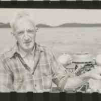          John Knapton exploring Dennys Bay in a skiff with archeologist Ted Stoddard in 1949.; Courtesy of the R.S. Peabody Museum, Andover, Massachusetts
   