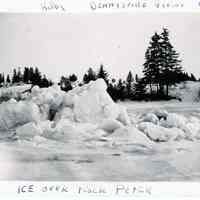          Ice over Rock Peter; Ice caps Rock Peter as the tide falls in the Dennys River estuary,  in this photograph by John P. Sheahan of Edmunds, c. 1885.
   