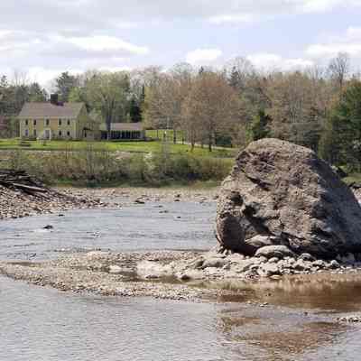 Rock Peter and the remains of T.W. Allan's wharf on the Dennys River.: The log cribbing from T.W. Allan's wharf on the Dennys River is visible beyond Rock Peter in Edmunds and the Lincoln House on the Dennysville shore.