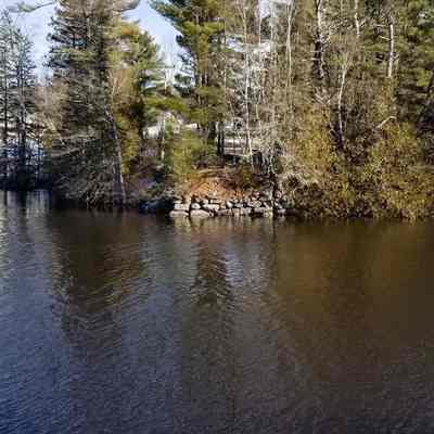 Abutment of the Lower Bridge , Dennys River, Maine: Stone abutment marking the eastern end of the Lower Bridge over the Dennys River in Edmunds, Maine.