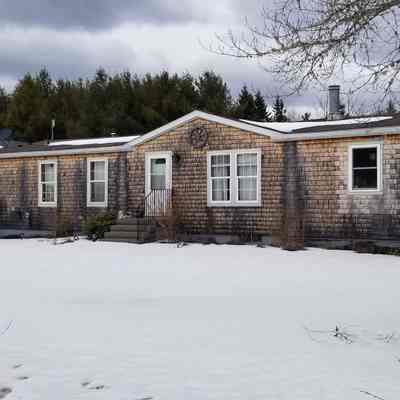 Site of Mill House n. 3 on the Lane in Dennysville, Maine: A recent modular dwelling has replaced one of the three houses built for millworkers and their families by the S.D. Warren Company in the early twentieth century.