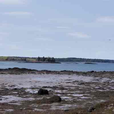 Little Dram Island, Dennys Bay, Maine: View of Little Dram Island, next to Dram Island in the Dennys Bay, as seen from the road to the Reversing Falls on Leighton's Neck, now part of Pembroke, Maine.