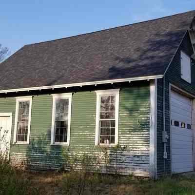 Lower Dennysville Schoolhouse, relocated in Pembroke, Maine.: After it closed in 1945, the former schoolhouse in Lower Dennysville was relocated a mile north on U.S. Route to Pembroke, where it has served as a garage and storage building.