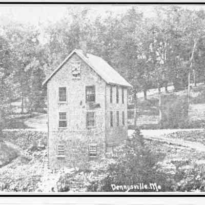 Earlier view from the Edmunds side of the Dennys River.: At the time of this depiction the building was Floriman Wilder's Machine  and Carpentry Shop.