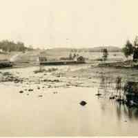          Fish Weir on the Dennys River; View of a fish weir on the Dennys River at low tide, with the Lincoln Dock, Wharf and Corn Hill in the background in the latter half of the nineteenth century.
   