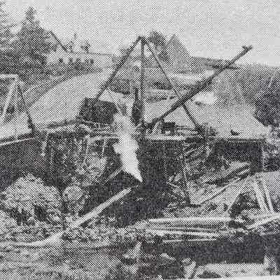 Bridge construction over Hobart Stream in 1926: The house built by Issac Hobart Jr., and later occupied by Nat Smith's house is visible on the hill in the background.
