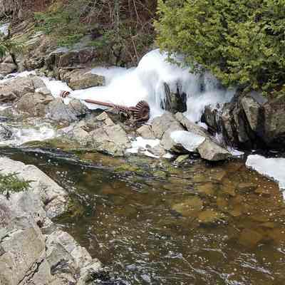 Iron gear shaft below stone dam on Crane Brook in Edmunds, Maine