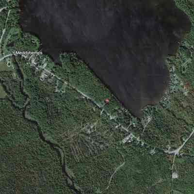 Meddybemps Village on Google Earth: The location of two nineteenth century schoolhouses, marked S.H. on the Colby Atlas above, are discernable at the junction of several roads to the east and west of the village in this satellite image  form Google Earth, accessed on 08-12-2023.