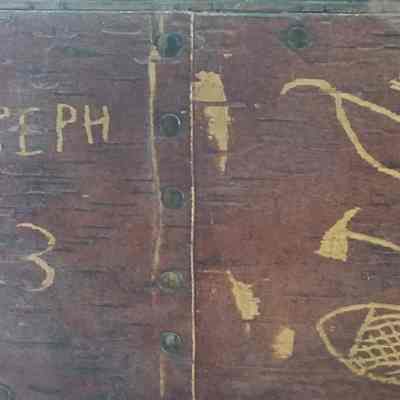 Tomah Joseph's signature, 1913: One time tribal Governor and birchbark artist Tomah Joseph recorded his name and distinctive Passamaquoddy tools on this decorative seat in 1913.  Image courtesy of Donald Soctomah from the Wabanaki Heritage Museum in Indian Township, Maine.