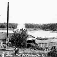          E.I. White's Steam Mill, with Hallowell's Island in the background, South Edmunds, Maine, c. 1905; Postcard view of E.I. Whites Steam Mill.  Note the small boy in the foreground.
   